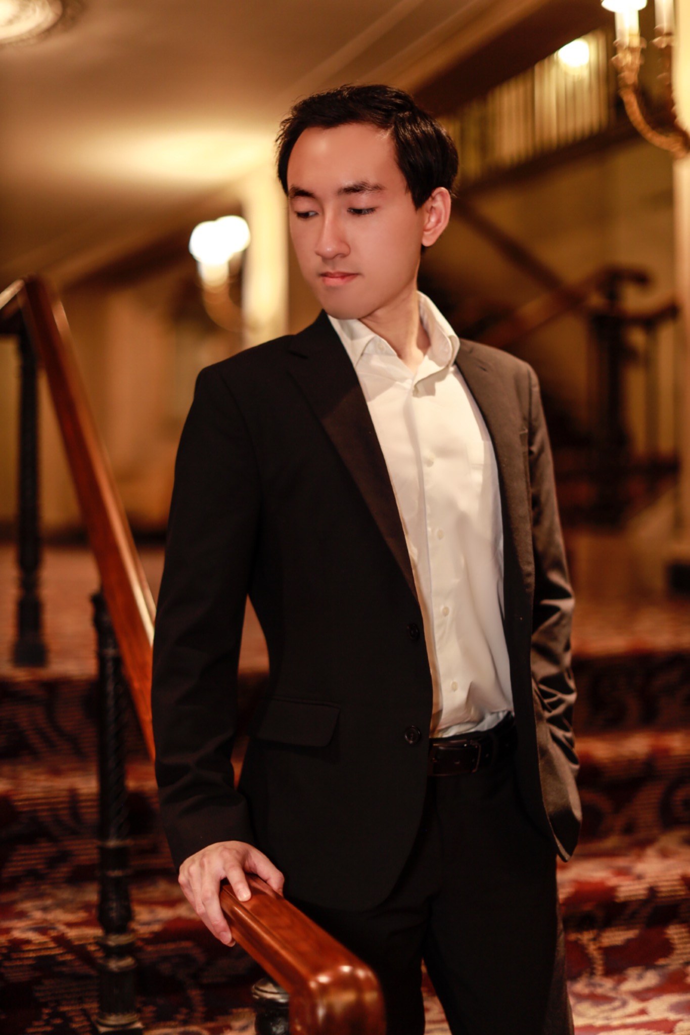 Haniel Anugerah standing in formal attire