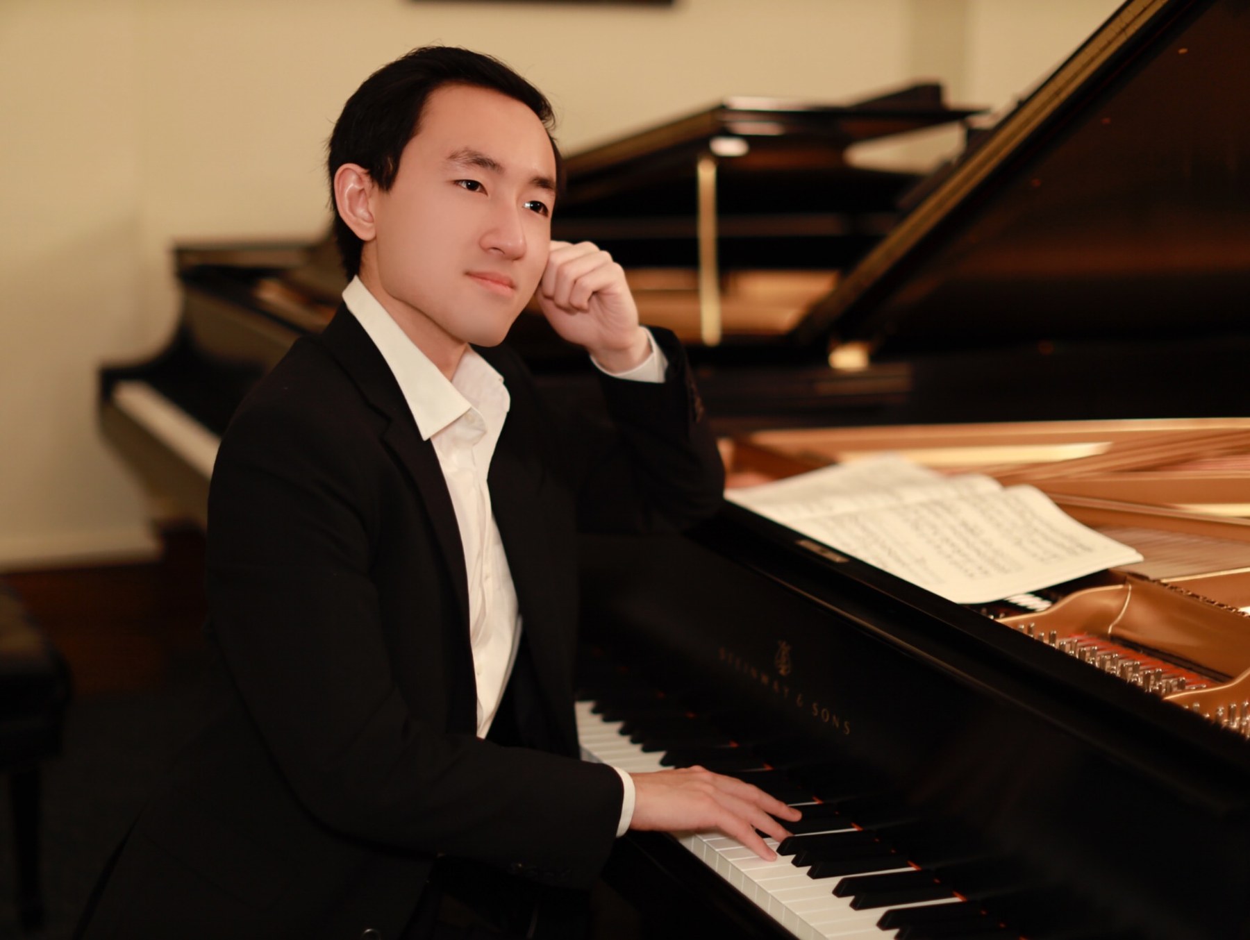 Haniel Anugerah seated at the piano